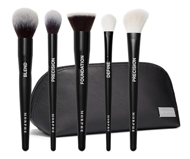 Morphe makeup brush set with black handles labeled for blending, precision, foundation, and defining, displayed in front of a black zippered makeup bag.