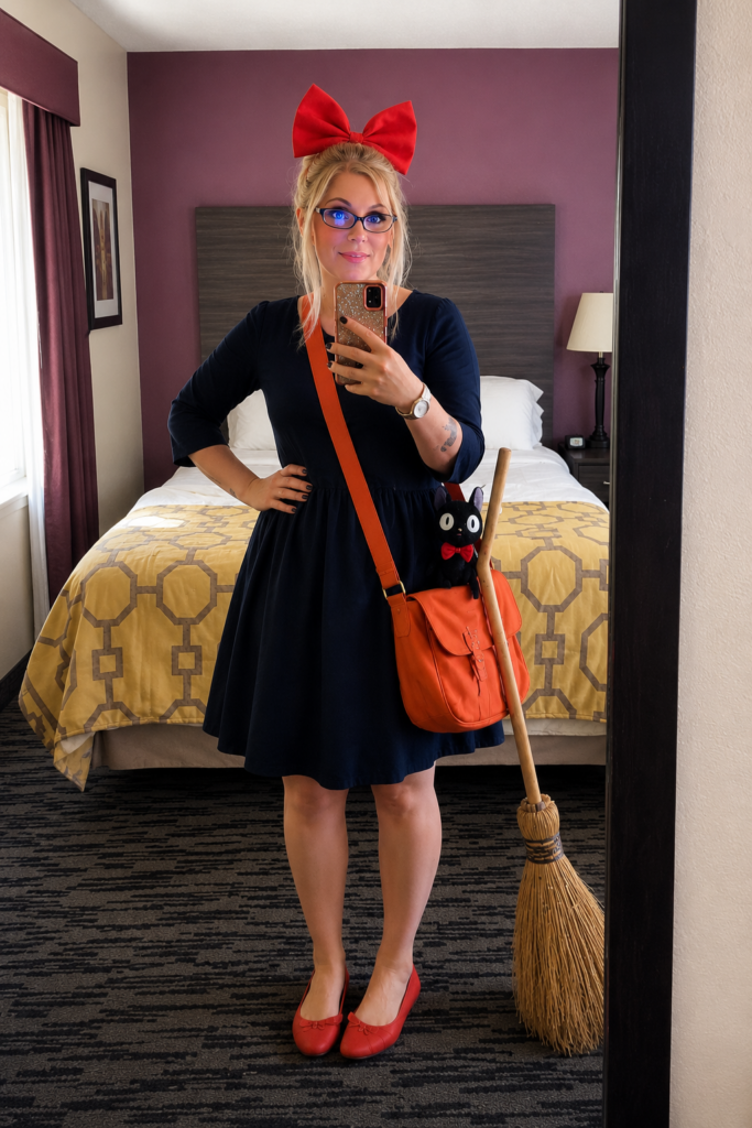 Girl dressed in cosplay for Anime Kiki from Kiki's Delivery Service.
