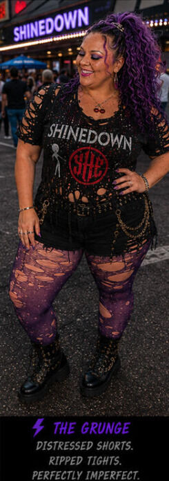 Woman modeling her DIY recreated band tee in front of a concert venue.