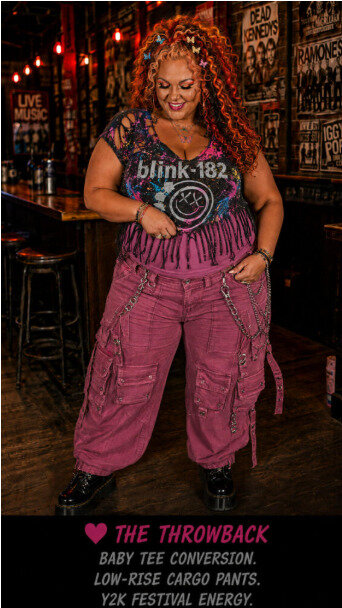Woman modeling a Y2K version of a DIY band tee idea in a bar scene.