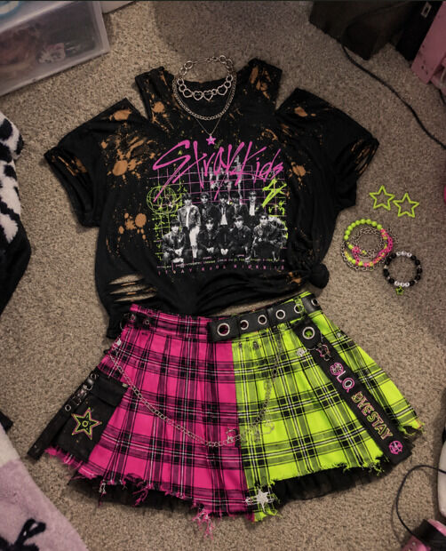 A cute punk grunge DIY outfit with a band tee and plaid skirt deconstructed look to wear to concerts.